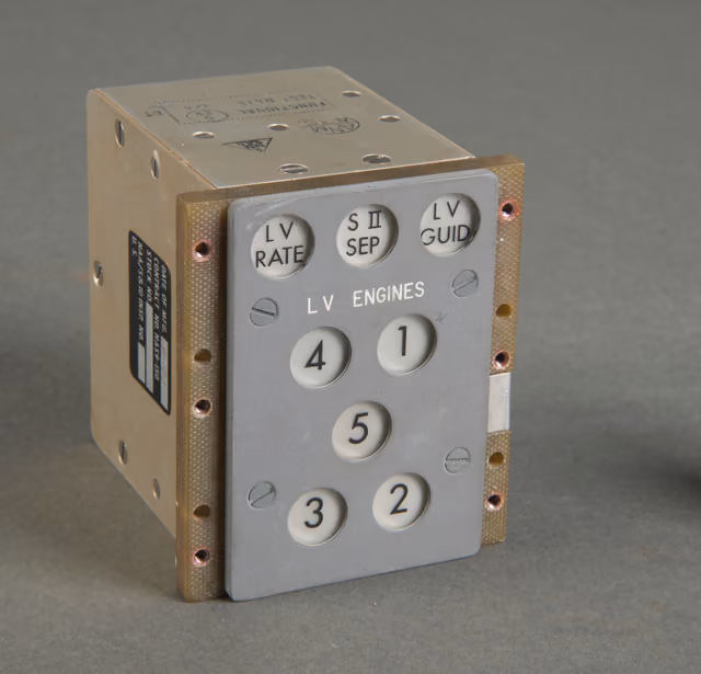 An engine annunciator panel from a Saturn V launch vehicle, a rectangular instrument face with labelled indicator windows for individual engines.